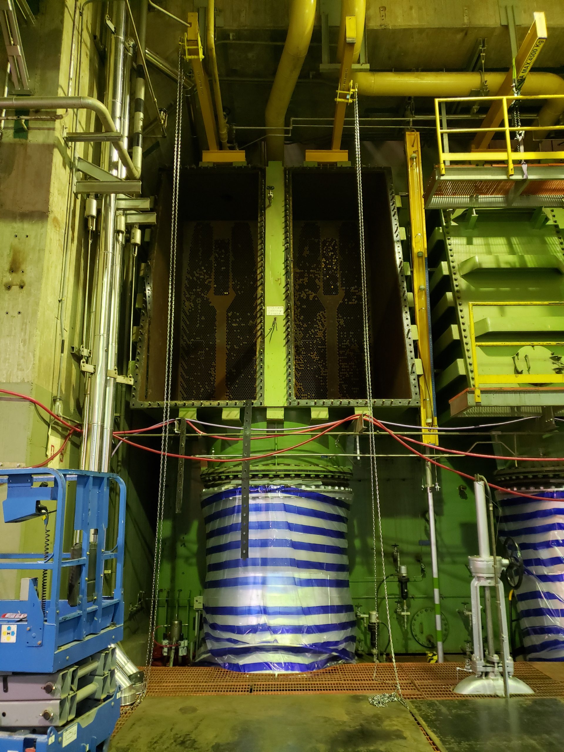 Installed multilayer closure disk bolted to a shell and tube heat exchanger during a refinery turnaround.